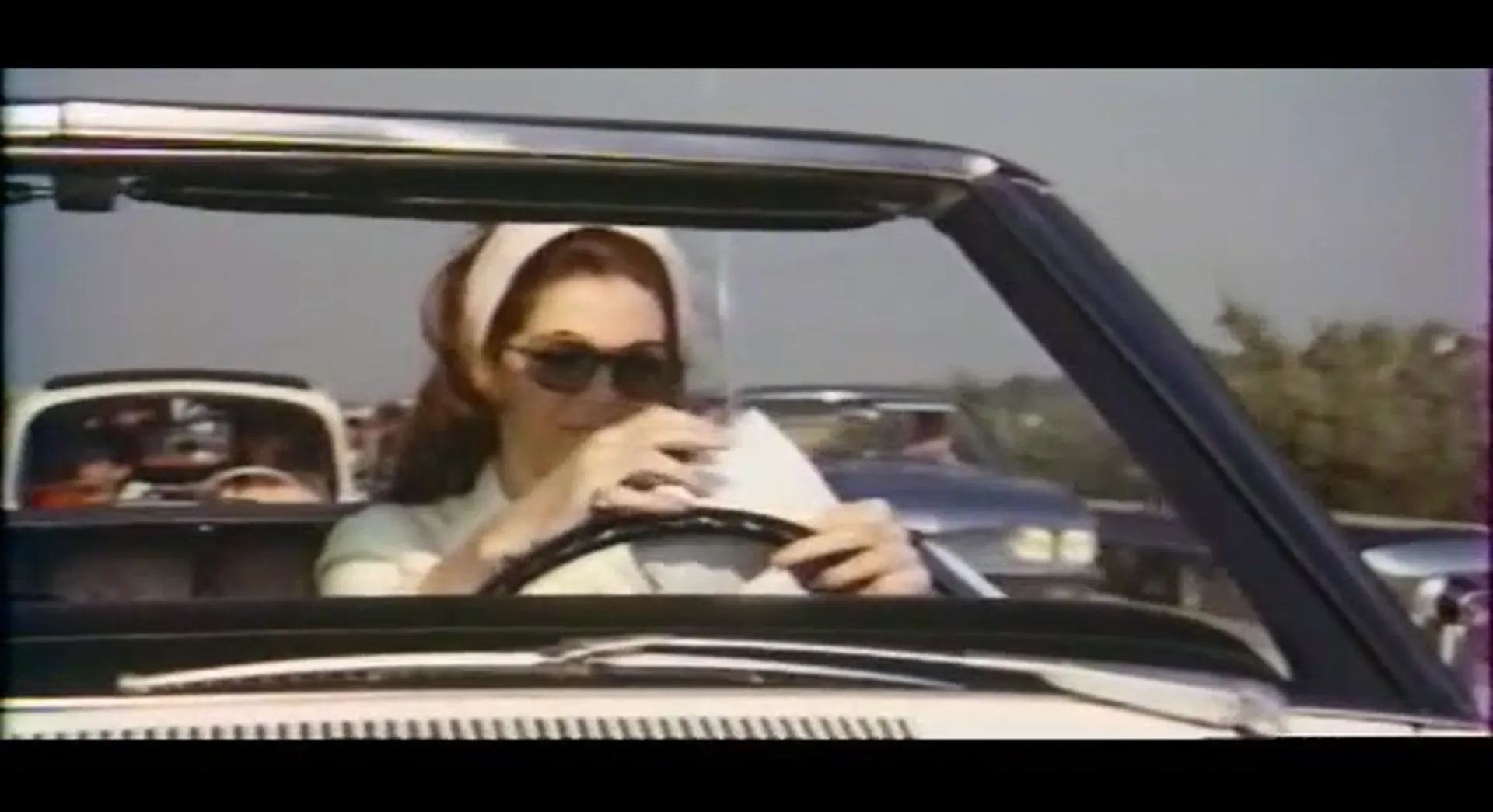 The Lady in the Car with Glasses and a Gun scene still 2
